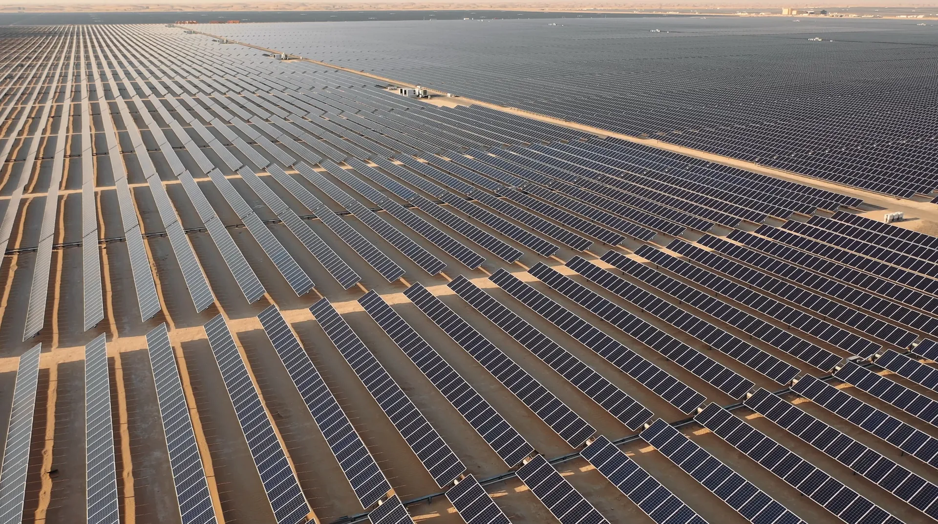 Aerial view of a vast solar farm in the desert