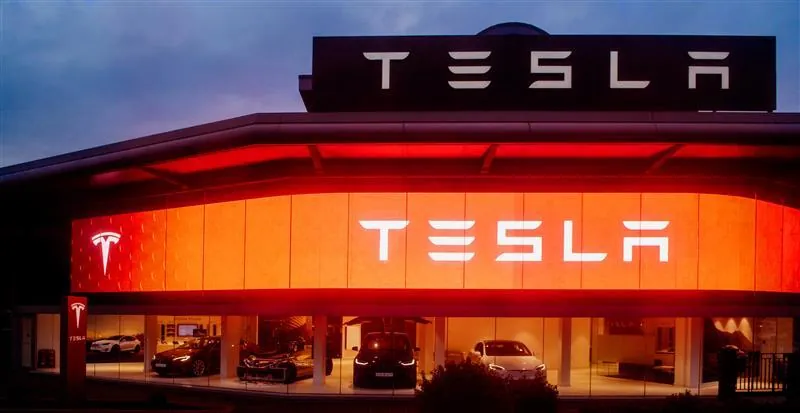 Tesla showroom illuminated at night